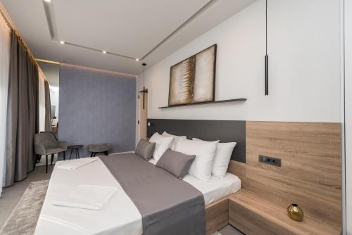 a hotel room with a bed and a table at Villa Aria in Novalja