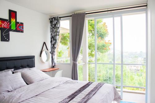 Cama ou camas em um quarto em The Dago View Bandung