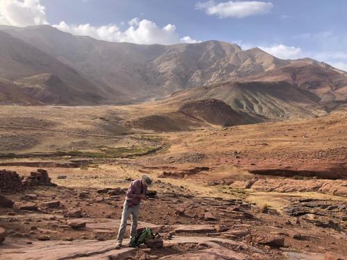 a man standing on top of a rocky mountain at Amlougui House in Marrakech