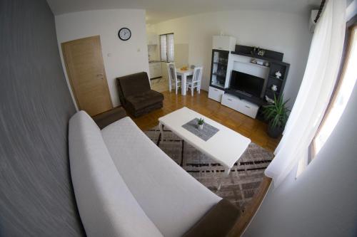 a living room with a couch and a table at Apartment Maša in Trebinje