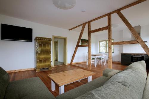 a living room with a couch and a table at Bahnhof Hohen Mistorf in Hohen Mistorf