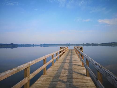 a wooden bridge over a body of water at Bahnhof Hohen Mistorf in Hohen Mistorf