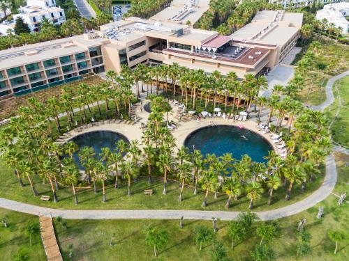 an aerial view of the resort with two pools and palm trees at NAU Sao Rafael Atlantico in Albufeira