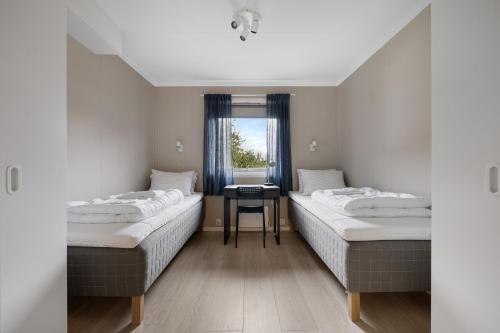 Säng eller sängar i ett rum på Master Apartment Hotels