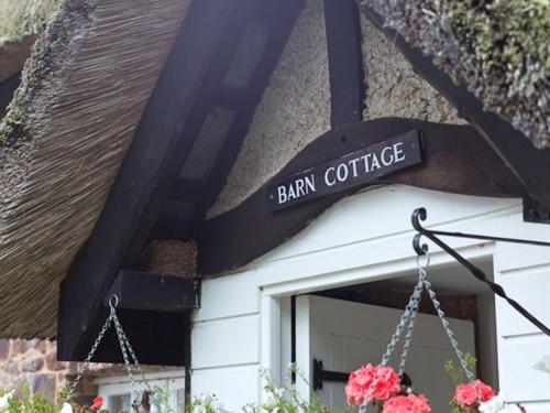 a sign that says barn coffee on the side of a building at Bickleigh Castle in Tiverton