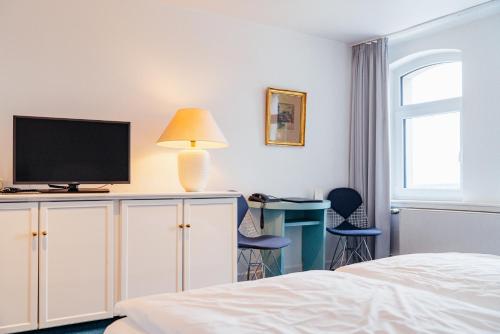 Hotel Benther Bergにあるテレビまたはエンターテインメントセンター