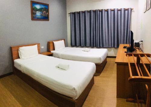 Una cama o camas en una habitación de ช้างเผือกเกสต์เฮ้าส์ Changphueak Guesthouse