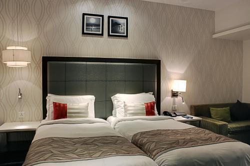 Voodi või voodid majutusasutuse The Sahil Hotel toas