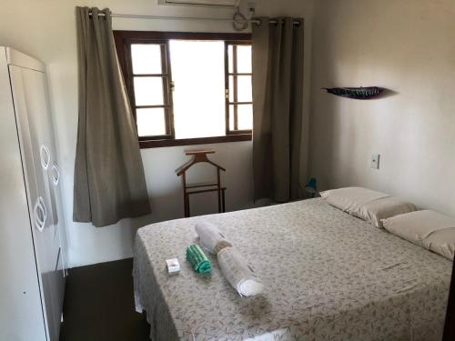 Postel nebo postele na pokoji v ubytování Casa Verde, beira da água com 2 suítes - Mar Doce!
