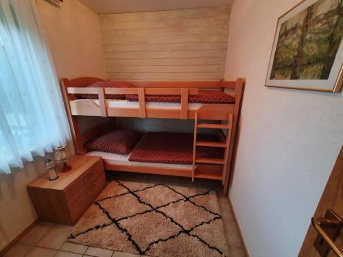 a room with two bunk beds in a room at Eifel Ferienwohnung Dahmen in Gerolstein