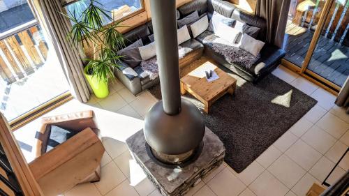 an overhead view of a living room with a couch at Chalet Robin - spa- multipass- terrain de pétanque in Morzine
