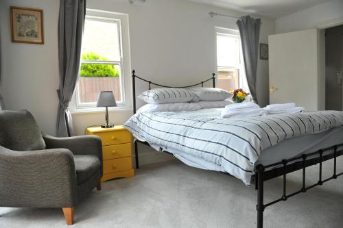 
A bed or beds in a room at Beechurst Serviced Apartments
