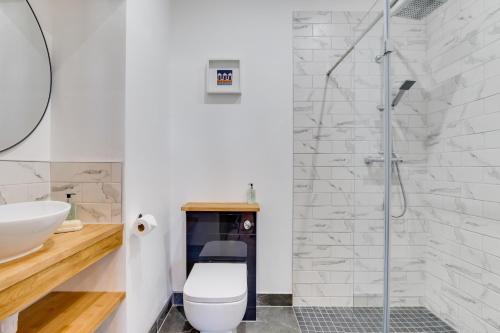 a bathroom with a toilet and a shower at Castle View in Bamburgh
