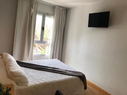 Postel nebo postele na pokoji v ubytování Hotel Villa de los Arcos