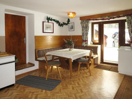 a kitchen with a table and chairs in a room at Holiday Home Willi - SOE425 by Interhome in Sölden