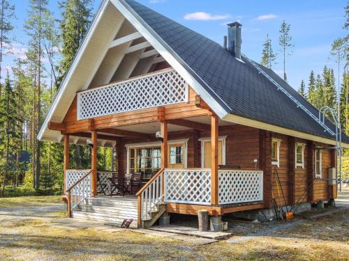 a small house with a gambrel roof at Holiday Home Rantakumpu by Interhome in Lieksa