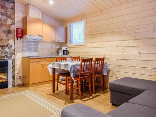 a kitchen and dining room with a table and chairs at Holiday Home Pikkuporo b by Interhome in Saariselka