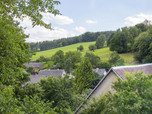 an aerial view of a village with trees and houses at Holiday Home Brníčko by Interhome in Brníčko