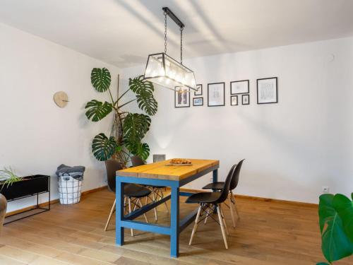 a dining room with a blue table and chairs at Holiday Home Brníčko by Interhome in Brníčko