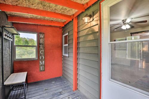 a porch with a bench next to a door at Altmar Family Home with Rivers and Trails Nearby! in Pulaski