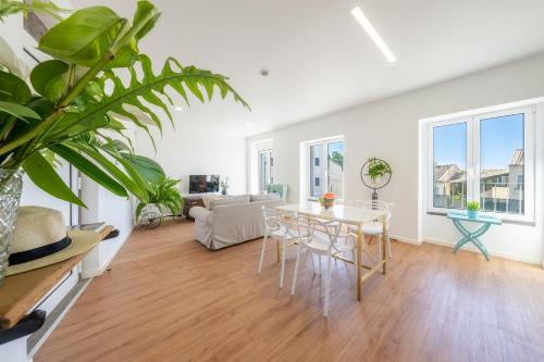 a living room with a table and chairs at Casa Amarela Apartments - by Casas na Ilha in Câmara de Lobos