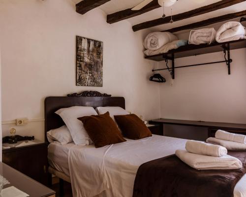 Ένα ή περισσότερα κρεβάτια σε δωμάτιο στο Casa Tato Figuerola d'Orcau