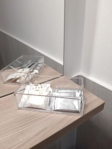 a table with a glass container on top of it at RipamontiBnB in Milan