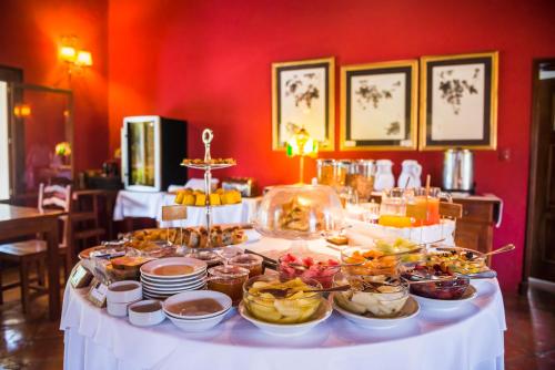 a table with a buffet of food on it at Viñas De Cafayate Wine Resort in Cafayate