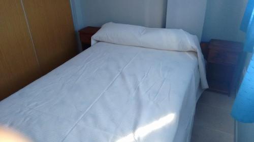 Una cama o camas en una habitación de Punta Gesell