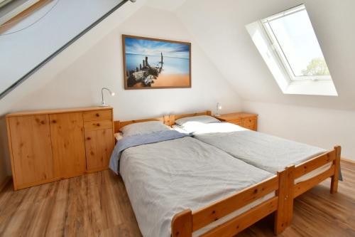 Postel nebo postele na pokoji v ubytování Strandperle 11, PP außen