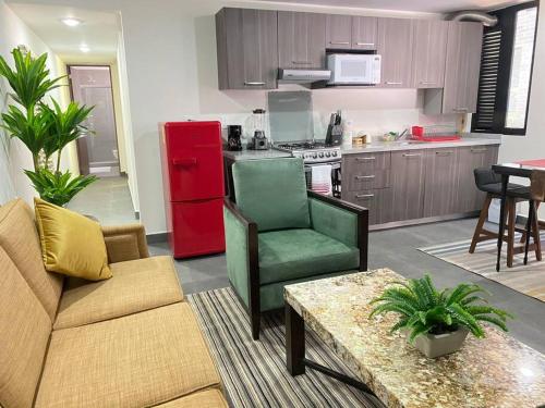 a living room with a couch and a red refrigerator at GRAN UBICACIÓN, en la zona de SANTA FE, KING BED in Mexico City