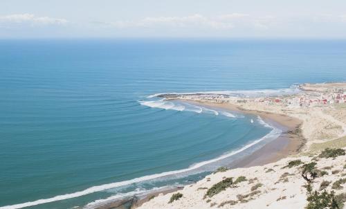 an aerial view of a beach and the ocean at TOODA House in Imsouane