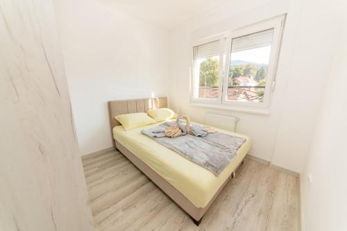 A bed or beds in a room at Apartman Jovana Banja Koviljaca