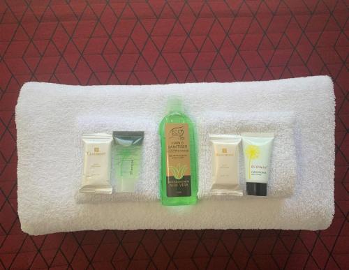 a shelf with three differentials of soap and cosmetics at George Williams Hotel in Brisbane