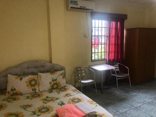 Krevet ili kreveti u jedinici u okviru objekta Hotel Pelita Terang