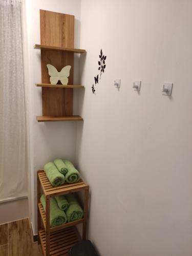 a corner of a room with green towels and shelves at Ferienhaus Neumann in Kinding