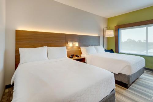 a hotel room with two beds and a window at Holiday Inn Express - Wilmington - Porters Neck by IHG in Wilmington