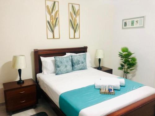 Uma cama ou camas num quarto em Casa Tonsupa Club del Pacifico