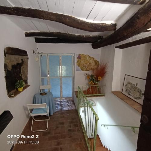 a staircase in a house with a window at Casa nella roccia in Bomarzo