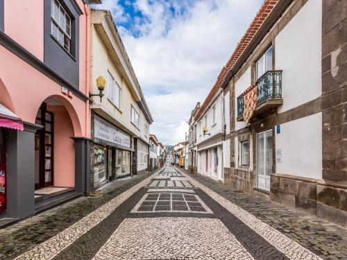 an alley in an old town in ireland at Facing Bay Hostel in Praia da Vitória