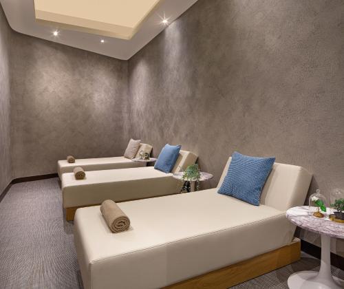 a living room with two couches and a table at Wanda Vista Istanbul in Istanbul