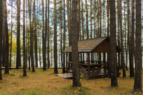 a wooden shelter in the middle of a forest at Park Hotel Burduguz in Burduguz