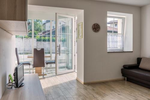 a living room with a couch and a table at Apartment Residence Veronika in Ora/Auer
