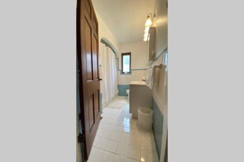 a bathroom with a toilet and a sink at Nikki's House in Cincinnati