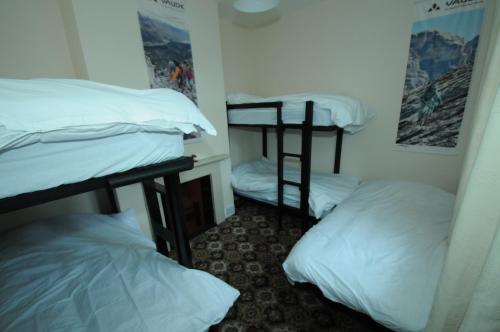 a room with three bunk beds in it at Clennell Hall Country House - Near Rothbury - Northumberland in Alwinton