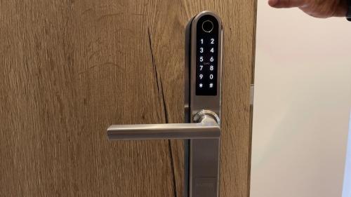 a close up of a door handle on a wooden door at VOK Pension in Neunkirchen am Sand