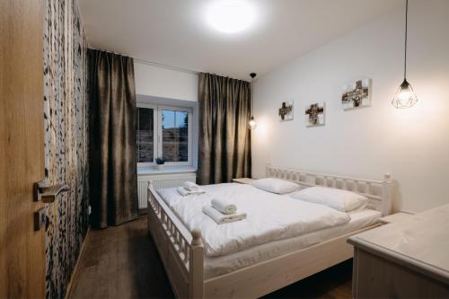 Кровать или кровати в номере Wellness penzion Marta