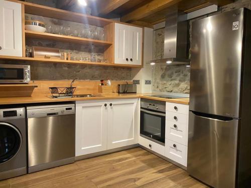 Kuchyň nebo kuchyňský kout v ubytování Loft Cal Pedrals