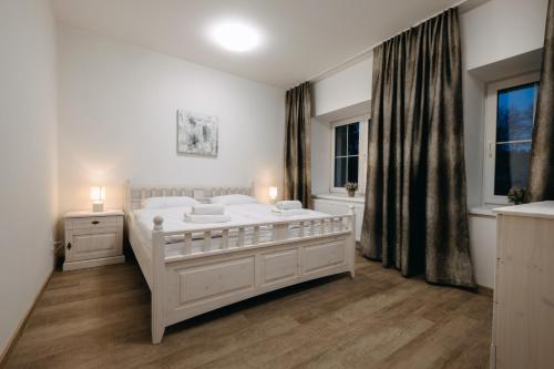 Кровать или кровати в номере Wellness penzion Marta