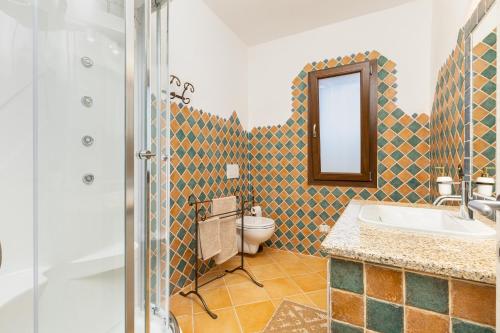 Kylpyhuone majoituspaikassa Villa Tomaso